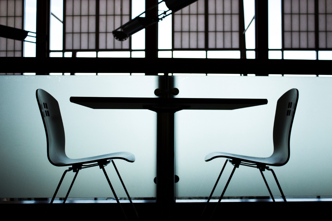 A table and two chairs as viewed from the side